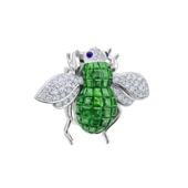 Brooch with tsavorites, sapphires, and diamonds, white gold.